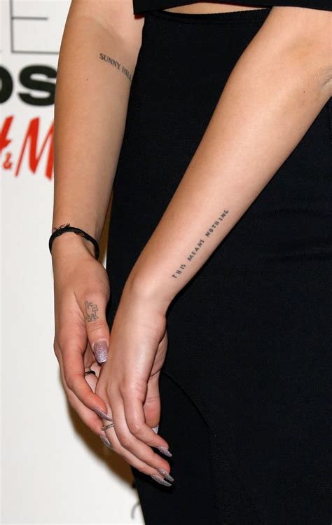 tatuajes dua lipa|Dua Lipa’s 13 Tattoos & Their Meanings